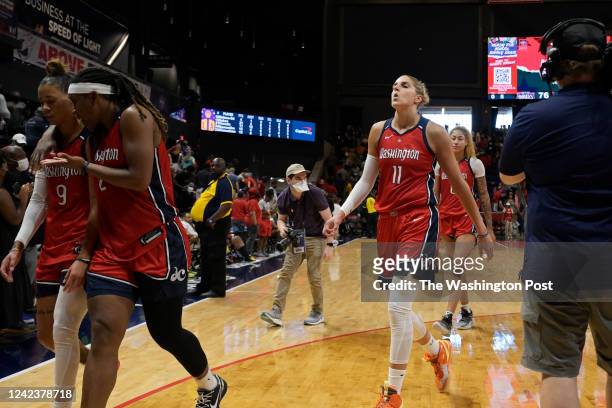 Washington Mystics forward Elena Delle Donne and other Washington Mystics walk off the court after their defeat by the Los Angeles Sparks in...