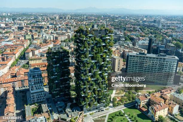 The Vertical Forest residential tower blocks, designed by Italian architect Stefano Boeri, left, in the Porta Nuova district seen from the UniCredit...