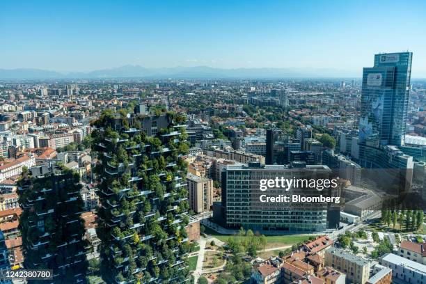 The Vertical Forest residential tower blocks, designed by Italian architect Stefano Boeri, left, in the Porta Nuova district seen from the UniCredit...
