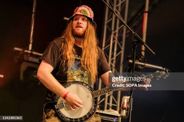 Sam Wood, Banjo, Mandolin, Bouzouki, Acoustic Guitar, Whistles and Accordion player with British folk band Ferocious Dog performs live on stage at...