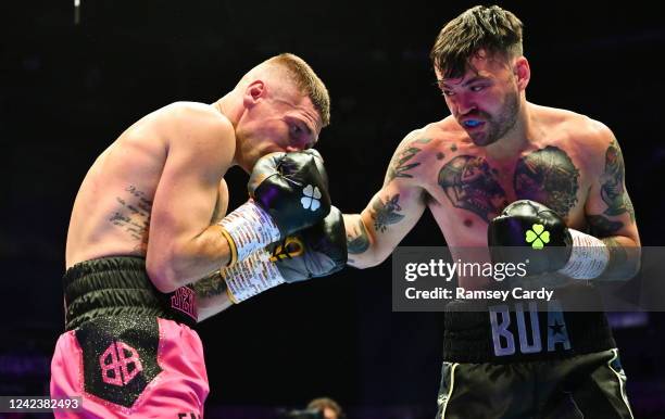 Belfast , United Kingdom - 6 August 2022; Tyrone McKenna, right, and Chris Jenkins during their welterweight bout at SSE Arena in Belfast.