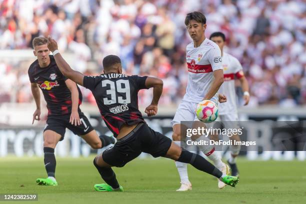 Dani Olmo of RB Leipzig, Benjamin Henrichs of RB Leipzig and Hiroki Ito of VfB Stuttgart battle for the ball during the Bundesliga match between VfB...