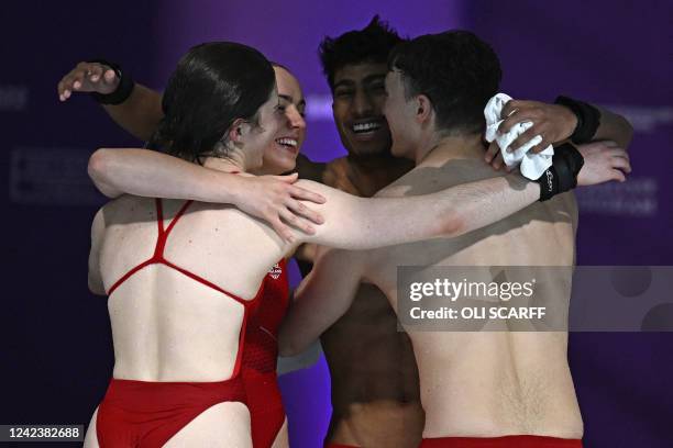 First-placed England's Andrea Spendolini-Sirieix and England's Noah Williams hug with second-placed England's Kyle Kothari and England's Lois Toulson...