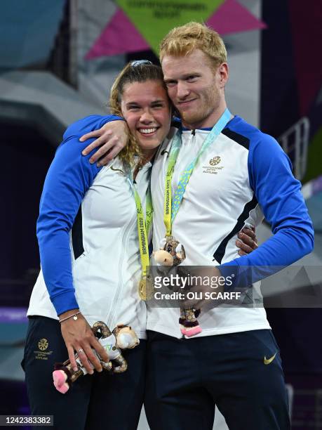 Gold medallists Scotland's Grace Reid and Scotland's James Heatly pose during the medal presentation ceremony for the mixed synchronised 10m platform...