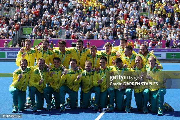 Gold medallists team Australia pose during a medal presentation ceremony for the men's hockey event on day eleven of the Commonwealth Games at the...