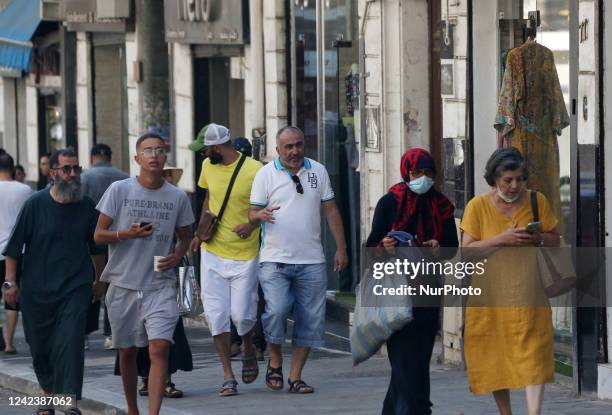 Photo taken on August 07 in Algiers, Algeria, shows people wearing a protective mask against the Corona virus , Algeria is experiencing a daily...