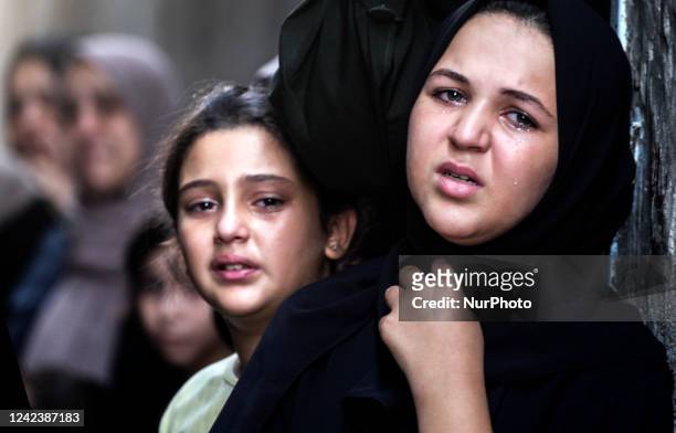 Palestinians relatives mourn the funeral of four Palestinian cousins from the Nejim family in Jabalia refugee camp north Gaza Strip, on 08 August,...