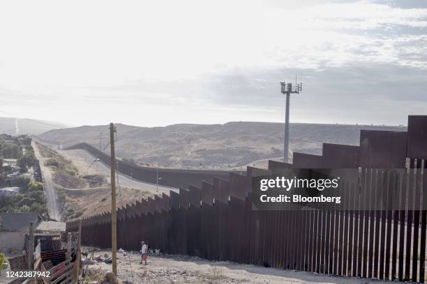 Section of the Mexico and US border fence in Tijuana, Mexico, on Sunday, Aug. 7, 2022. Mexican migrants attempting to cross into the US without...