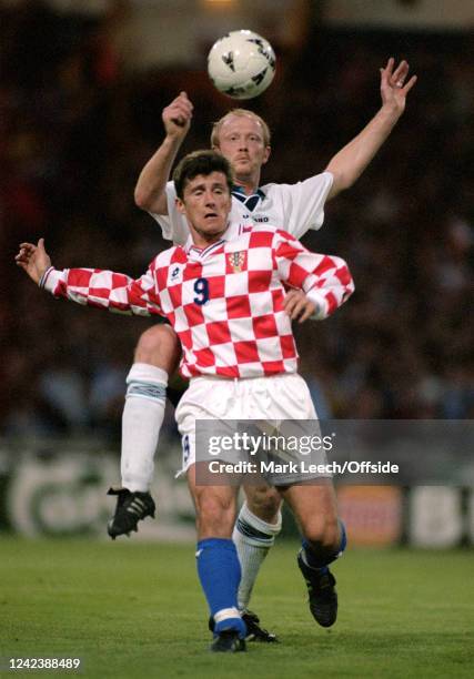 April 1996, London - International Friendly - England v Croatia - Davor Suker of Croatia is challenged by Mark Wright of England.