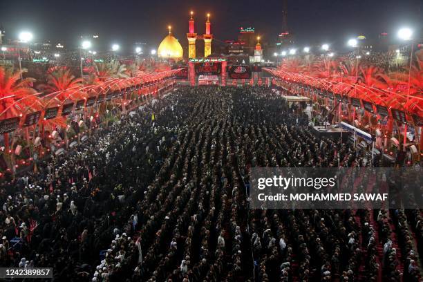 Shiite pilgrims pray outside the shrine of Imam Hussein during Ashura, a 10-day period commemorating the seventh century killing of Prophet...