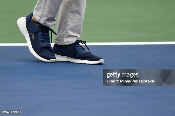 Chair umpire Isabell Seefried tests play conditions on court 9 prior to the match between Alex Molcan of Slovakia and Mackenzie McDonald of the...