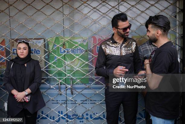 Iranian youths attend a Muharram religious ceremony to mark Ashoura, in downtown Tehran, amid the 7th-Wave of the New Coronavirus disease outbreak in...