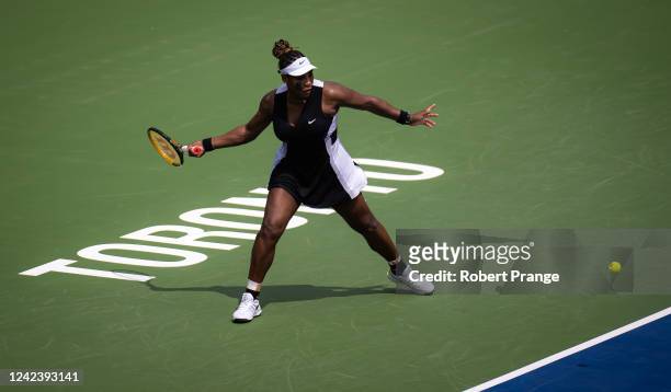 Serena Williams of the United States hits a shot against Nuria Parrizas Diaz of Spain during her first round match on Day 3 of the National Bank...