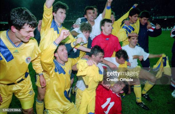 November 1993, Cardiff - FIFA World Cup Qualifying Group 4 - Wales v Romania - Gheorge Hagi lies on the floor wearing a Welsh jersey as Romania...
