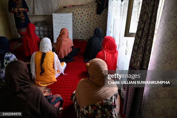 This photo taken on July 24, 2022 shows girls studying in a secret school at an undisclosed location in Afghanistan. Hundreds of thousands of girls...