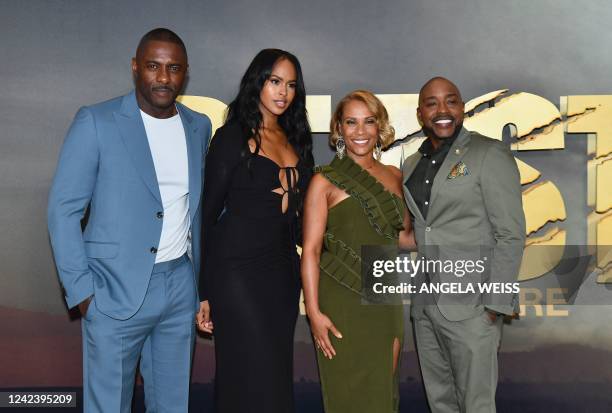 British actor Idris Elba, wife actress Sabrina Dhowre, Heather Packer, and husband US producer Will Packer attend the world premiere of "Beast" at...