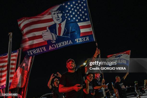 Supporters of former US President Donald Trump stand outside his residence in Mar-A-Lago, Palm Beach, Florida on August 8, 2022. - Former US...