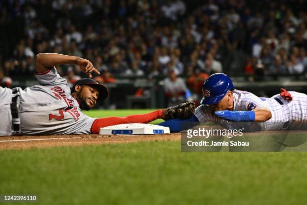 Rafael Ortega of the Chicago Cubs slides under the tag of Maikel Franco of the Washington Nationals to steal third base in the seventh inning at...