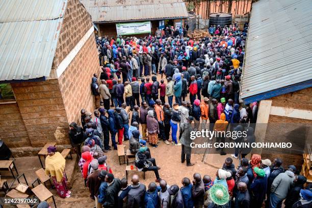 Voters queue at the Olympic primary school polling station in Kibera to vote for Kenya's general election on August 9, 2022.