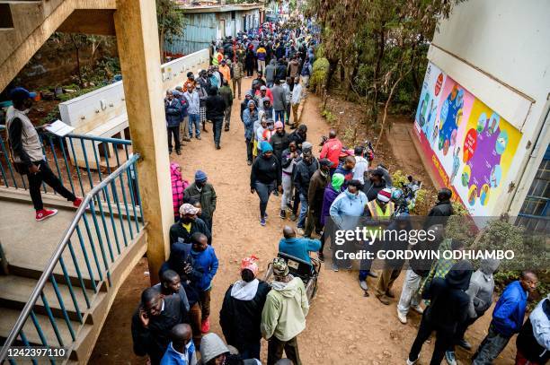Voters queue at the Olympic primary school polling station in Kibera to vote for Kenya's general election on August 9, 2022.