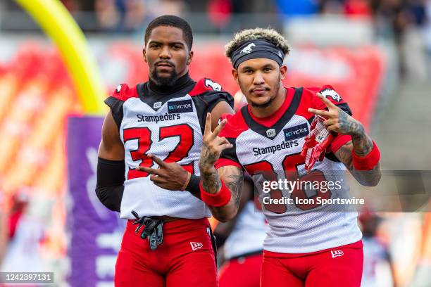 Calgary Stampeders defensive back Titus Wall and Darius Williams pose for a photo during warm-up before Canadian Football League action between the...