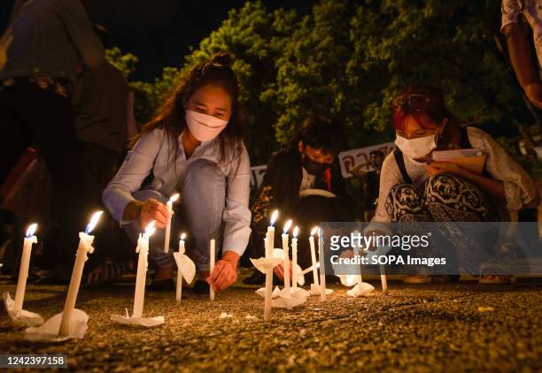 Activists light the candles during the anniversary of the '8888 Uprising' at Tha Phae Gate in Chiang Mai. On the 8th of August, Myanmar commemorated...