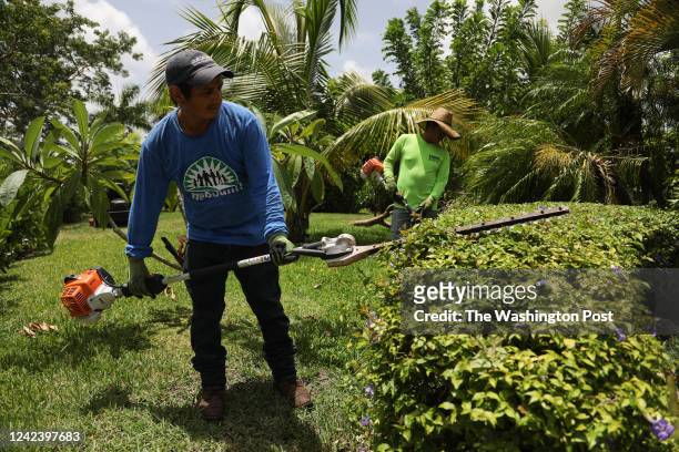 Homestead, Florida landscaper Carlos Morales, a member of WeCount!, a labor union of low wage immigrant workers and their families, wears his...