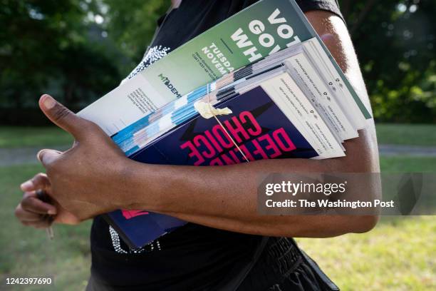 Pontiac, MI Regina Campbell, of Pontiac, holds her paperwork for knocking on doors to tell residents about issues on the ballot in the fall,...