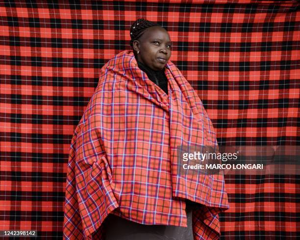 Anne Wangiru a shopkeeper, poses for a portrait after voting during the Kenyan general elections at the Ilbillis Primary School in Kajiado on August...