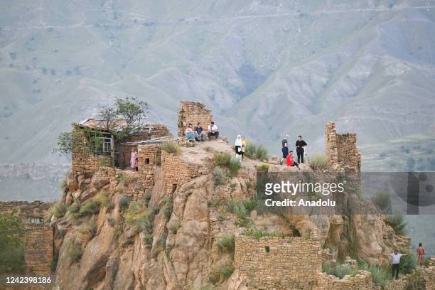Tourists visit the Gamsutl village, Russia's third oldest settlement, meaning "at the foot of the Khan's tower" an abandoned town in Dagestan,...