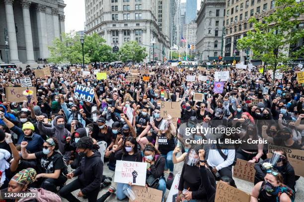 Massive group of protesters sit on the ground at Foley Square in a show of peaceful protest. Protesters took to the streets across America after the...