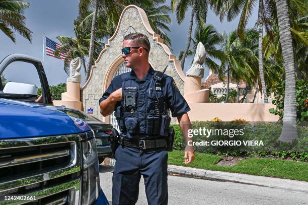 Local law enforcement officers are seen in front of the home of former President Donald Trump at Mar-A-Lago in Palm Beach, Florida on August 9, 2022....