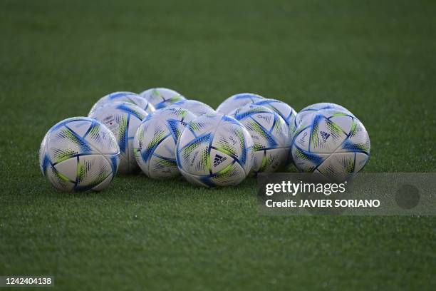 The official balls are seen on the pitch during a training session on the eve of the UEFA Super Cup football match between Real Madrid vs Eintracht...