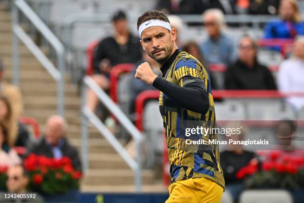 Grigor Dimitrov of Bulgaria reacts after winning a game against Alexis Galarneau of Canada during Day 4 of the National Bank Open at Stade IGA on...