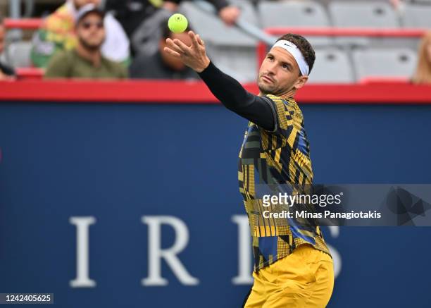 Grigor Dimitrov of Bulgaria serves against Alexis Galarneau of Canada during Day 4 of the National Bank Open at Stade IGA on August 9, 2022 in...
