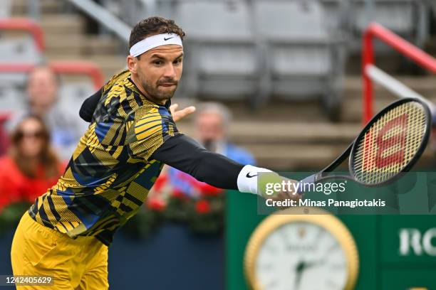 Grigor Dimitrov of Bulgaria hits a return against Alexis Galarneau of Canada during Day 4 of the National Bank Open at Stade IGA on August 9, 2022 in...