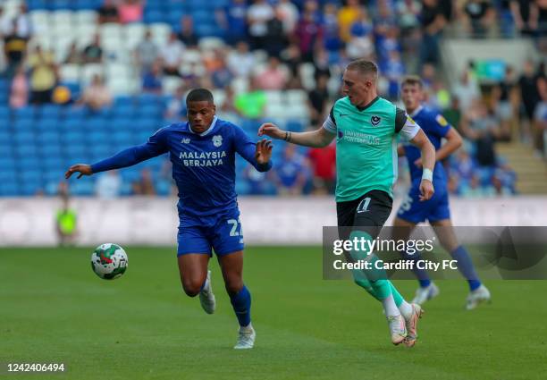 Vontae Daley-Campbell of Cardiff City FC and Ronan Curtis of Portsmouth during the Carabao Cup First Round match between Cardiff City and Portsmouth...