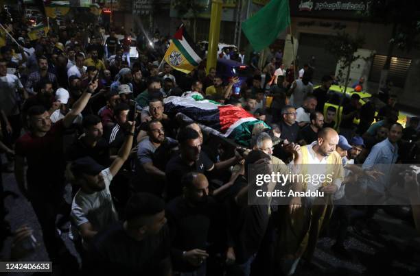 Palestinians gather to attend the funeral ceremony held for Palestinian Moamen Yassin Jaber shot in chest by Israeli forces and underwent surgery at...