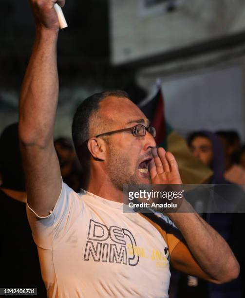 Palestinians shout slogans as they gather to attend the funeral ceremony held for Palestinian Moamen Yassin Jaber shot in chest by Israeli forces and...