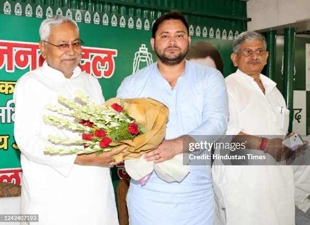 Leader Tejashwi Yadav hosts JDU leader Nitish Kumar during a meeting at Rabri Devi's residence on August 9, 2022 in Patna, India. Bihar Chief...