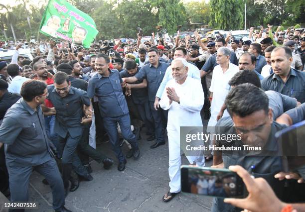 Leader Nitish Kumar with RJD leader Tejashwi Yadav after meeting Bihar Governor Phagu Chauhan to form a new government, at Raj Bhawan on August 9,...