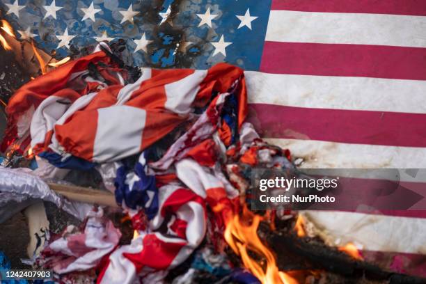 At an anti-Israel protest in downtown Tehran, U.S. Flags burn on a corner of the Palestine square on August 9, 2022. Iran's Revolutionary Guard Corps...