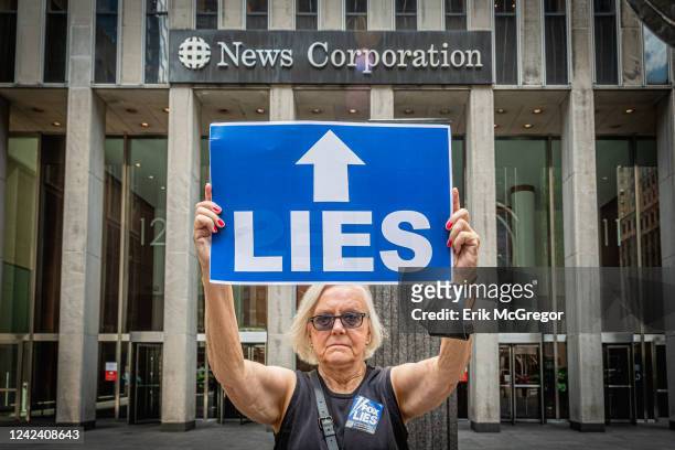 Participant seen holding a sign at the protest. Members of the activist groups Truth Tuesdays and Rise and Resist gathered at the weekly FOX LIES...