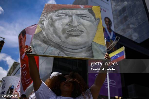 Supporters of Venezuelan President Nicolas Maduro take part in a protest demanding the return of disputed gold held in the UK and the plane seized at...