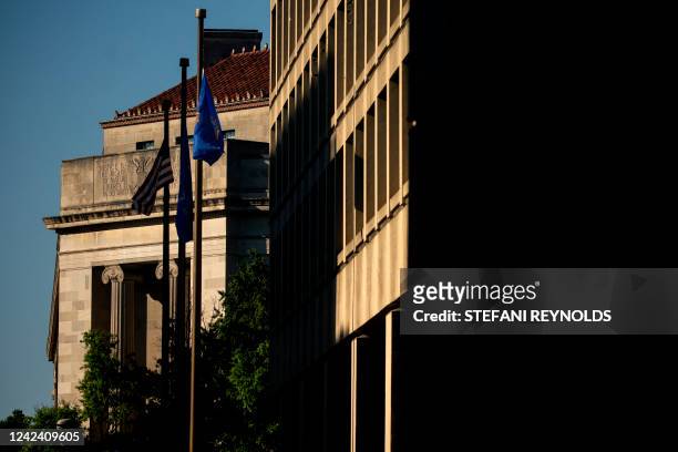 The Department of Justice building is seen past the J. Edgar Hoover FBI building in Washington, DC, on August 9, 2022.
