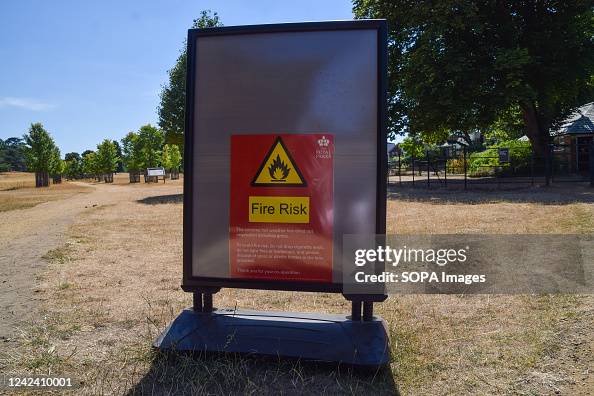 Increased Fire Risk Sign A fire risk sign is seen in a dry Richmond Park as heatwaves and ...