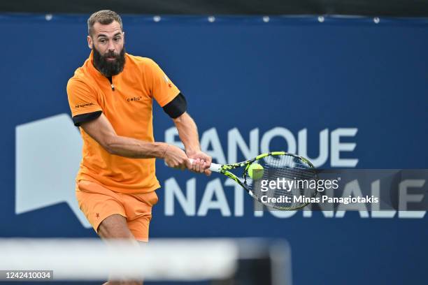 Benoit Paire of France hits a return against Yoshihito Nishioka of Japan during Day 4 of the National Bank Open at Stade IGA on August 9, 2022 in...