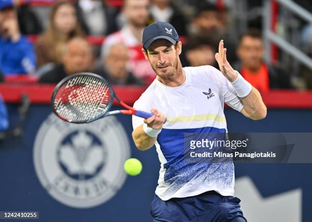 Andy Murray of Great Britain hits a return against Taylor Fritz of the United States during Day 4 of the National Bank Open at Stade IGA on August 9,...