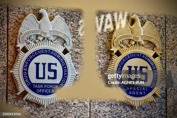 Drug Enforcement Administration Task Force Officer badge is displayed next to a Drug Enforcement Administration Special Agent badge at the DEA...