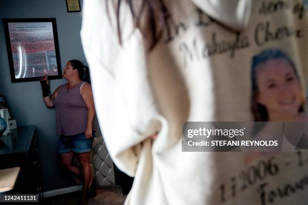 Shannon Doyle, mother of Makayla Cox, reads a poem displayed in her daughters bedroom at her home in Virginia Beach, Virginia, on June 22, 2022. -...